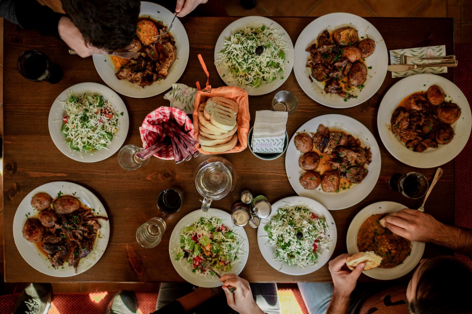 A table full of food, shared by friends